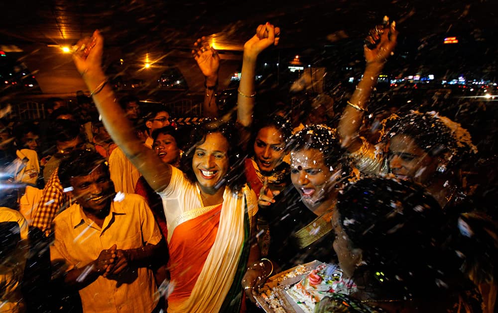 Members of the transgender community celebrate the passage of a bill seeking equal rights for transgenders in the country’s upper house, in Bhubaneswar.