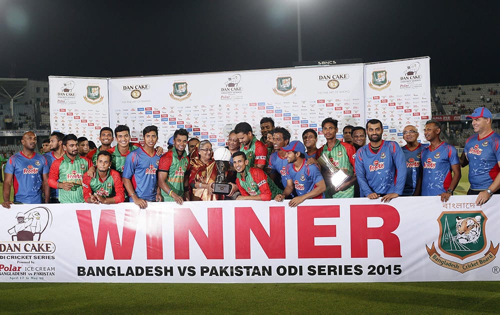 Bangladesh’s players pose for a photograph with Bangladesh Prime Minister Sheikh Hasina, center, during the presentation ceremony after the Twenty20 international cricket match in Dhaka.