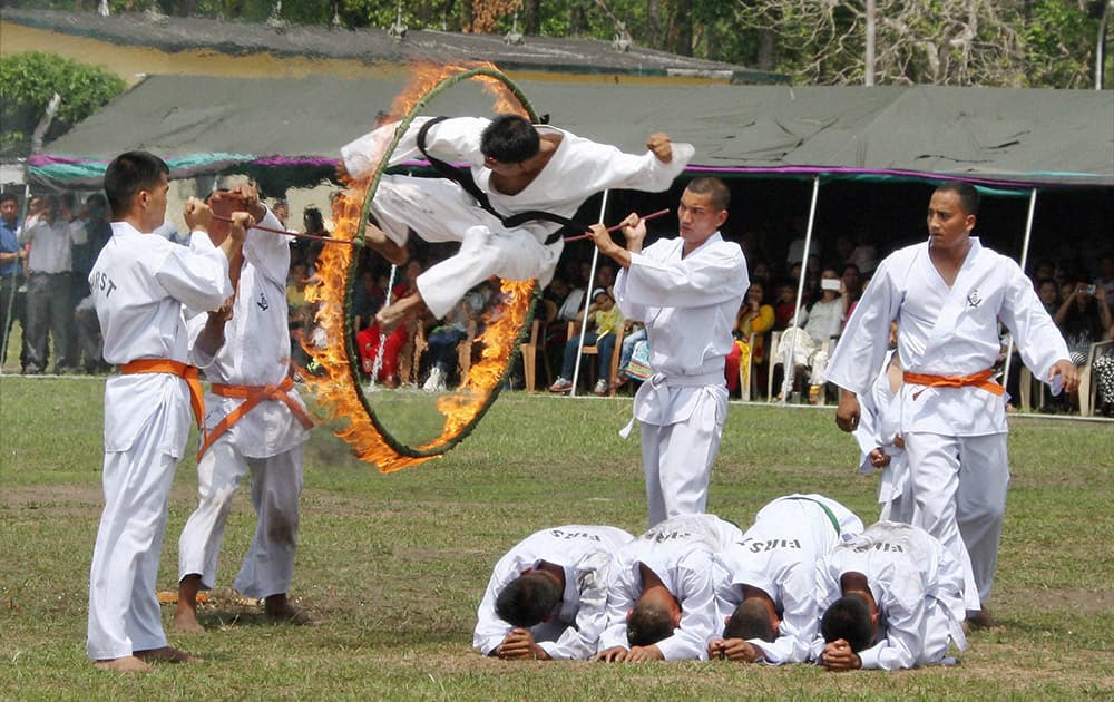 Jawans of the 1st Battalion of the ‘Third Gorkha Rifles’ (1/3 GR), perform stunts during a ceremony to commemorate its bicentenary in Siliguri, West Bengal.