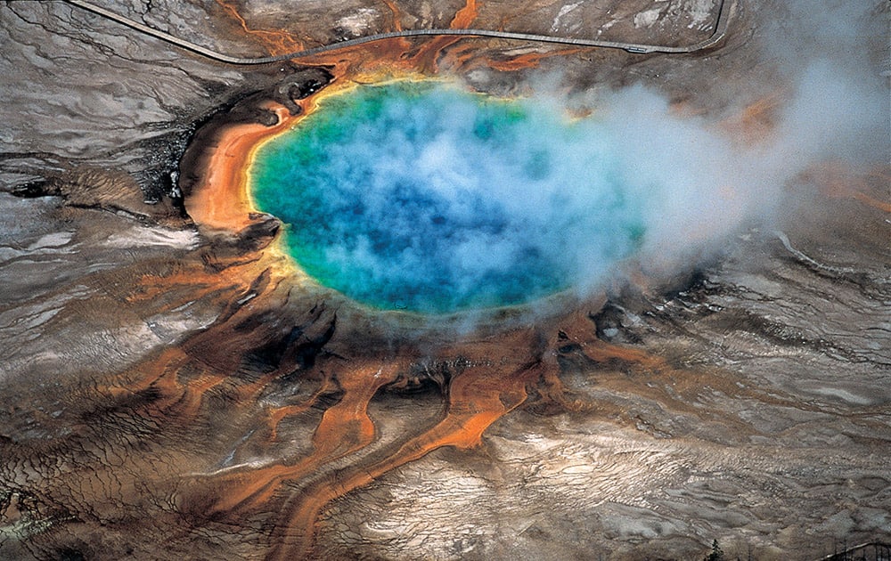 This undated photo provided by Robert B. Smith shows the Grand Prismatic hot spring in Yellowstone National Park's that is among the park's myriad hydrothermal features created by the fact that Yellowstone is a supervolcano, the largest type of volcano on Earth. 