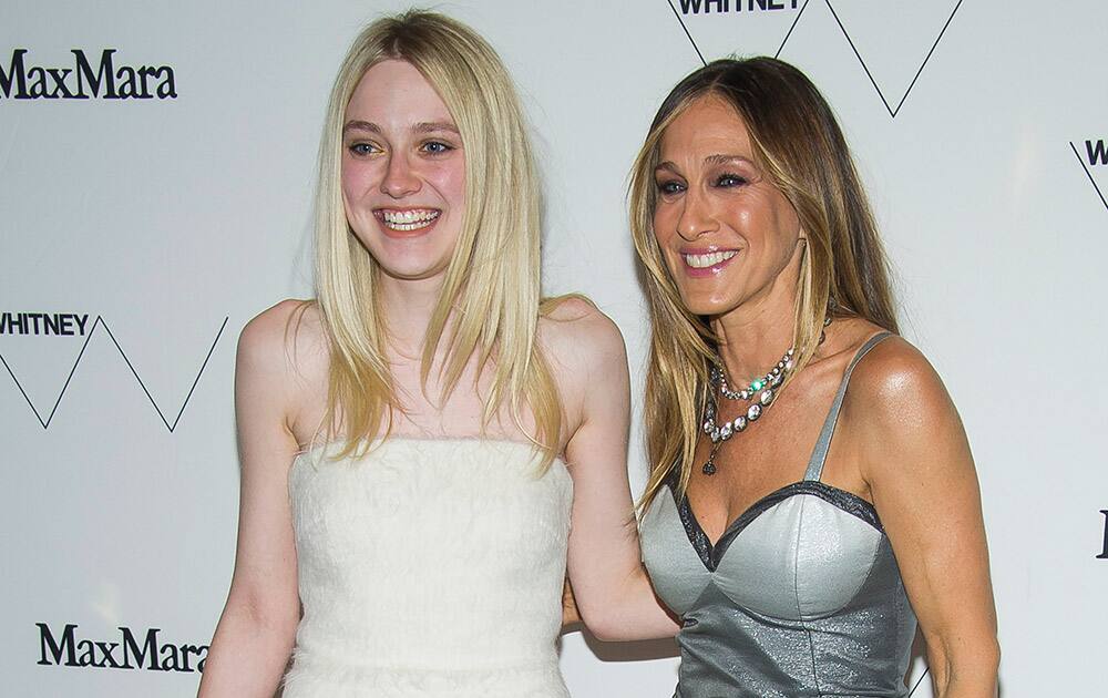 Dakota Fanning and Sarah Jessica Parker attend the Whitney Museum of American Art's opening night party at it's new downtown location, in New York.