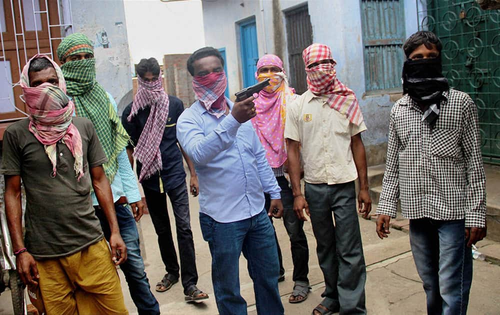 Hooligans threat media with a weapon near a polling booth during Municipal elections at Katwa in Burdwan district.