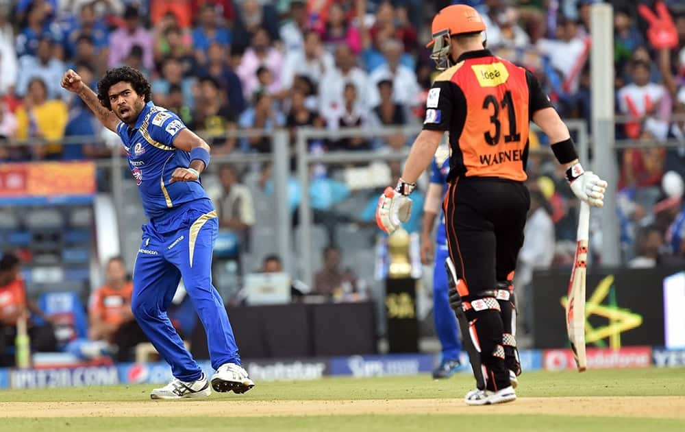 Mumbai Indian's Lasith Malinga celebrates after dismissing David Warner of Sunrisers Hyderabad during the IPL match in Mumbai.