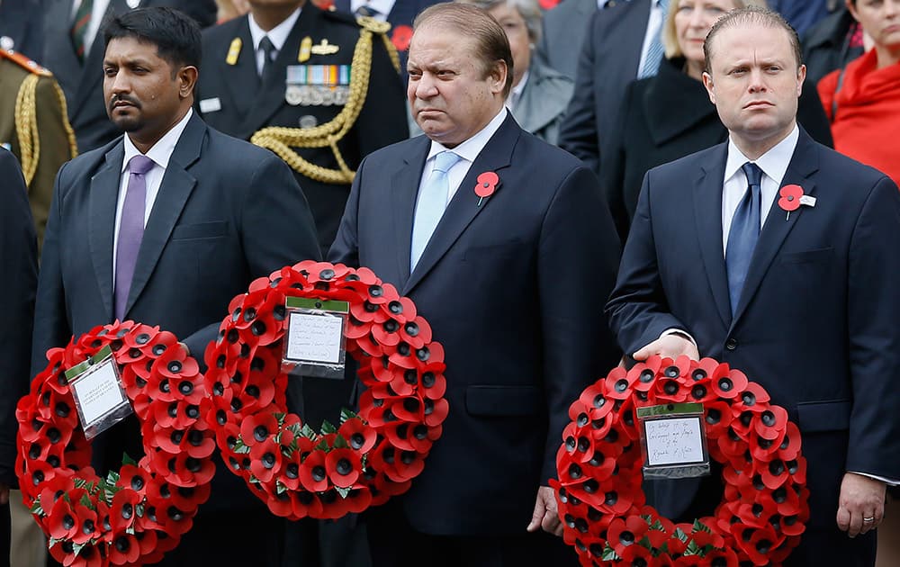 Pakistan's Prime Minister Nawaz Sharif holds a wreath during a ceremony at the Cenotaph to commemorate ANZAC Day and the Centenary of the Gallipoli Campaign in Whitehall, London.