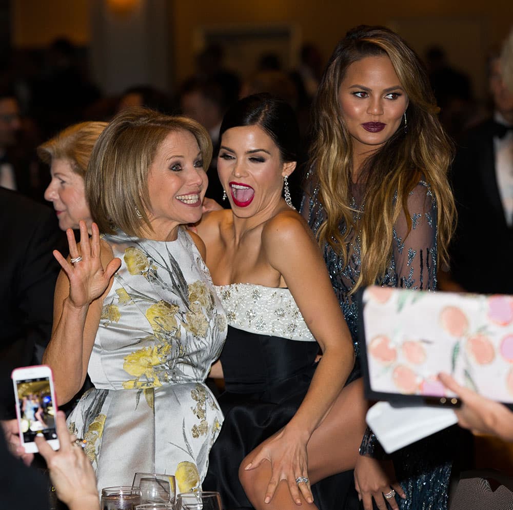 News personality Katie Couric, left, Jenna Dewan-Tatum, center, and model Chrissy Teigen mingle during the White House Correspondents' Association dinner at the Washington Hilton, in Washington.