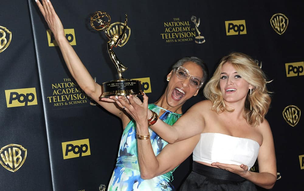 Carla Hall, left, and Daphne Oz pose in the pressroom with the award for outstanding informative talk show host for “The Chew” at the 42nd annual Daytime Emmy Awards at Warner Bros. Studios.