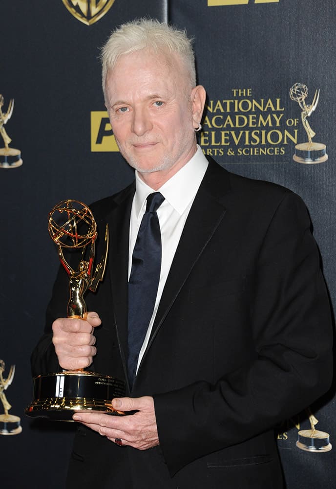 Anthony Geary poses in the pressroom with the award for outstanding lead actor in a drama series for “General Hospital” at the 42nd annual Daytime Emmy Awards at Warner Bros. Studios.