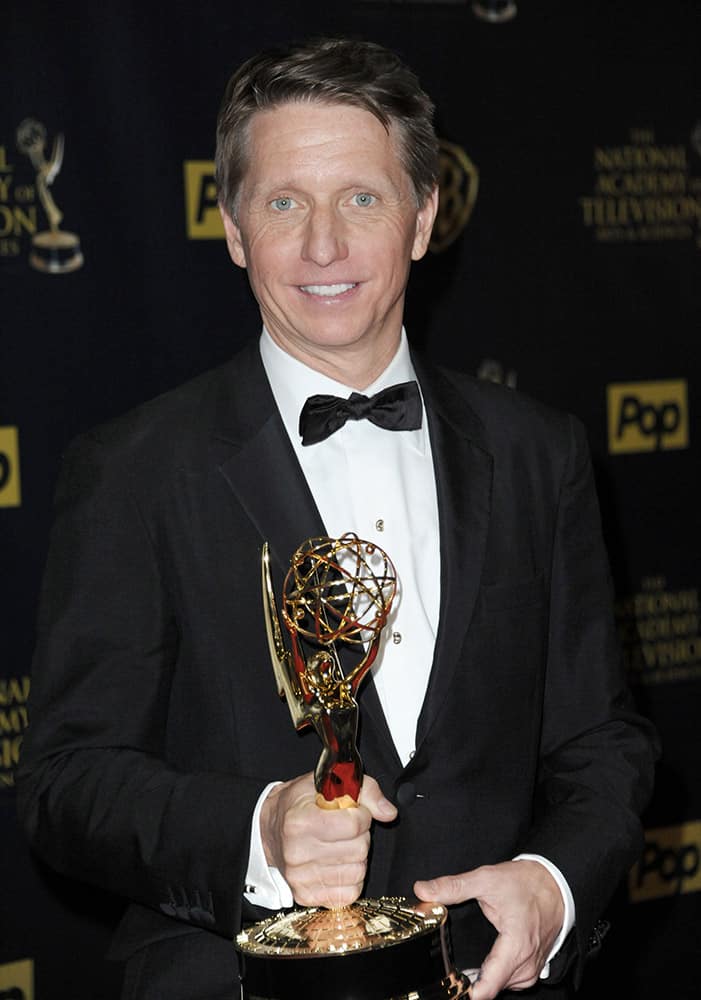 Bradley Bell poses in the pressroom with the award for outstanding drama series for “Days of Our Lives” at the 42nd annual Daytime Emmy Awards at Warner Bros. Studios.