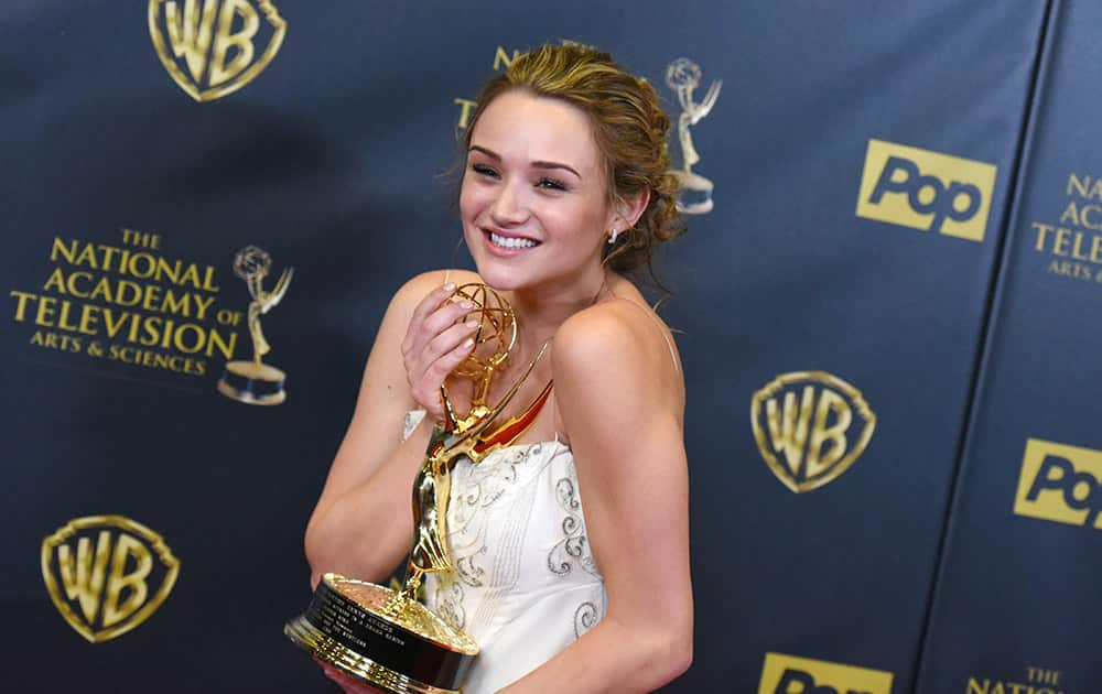 Hunter King poses in the pressroom with the award for outstanding younger actress in a drama series at the 42nd annual Daytime Emmy Awards at Warner Bros. Studios, in Burbank, Calif. 