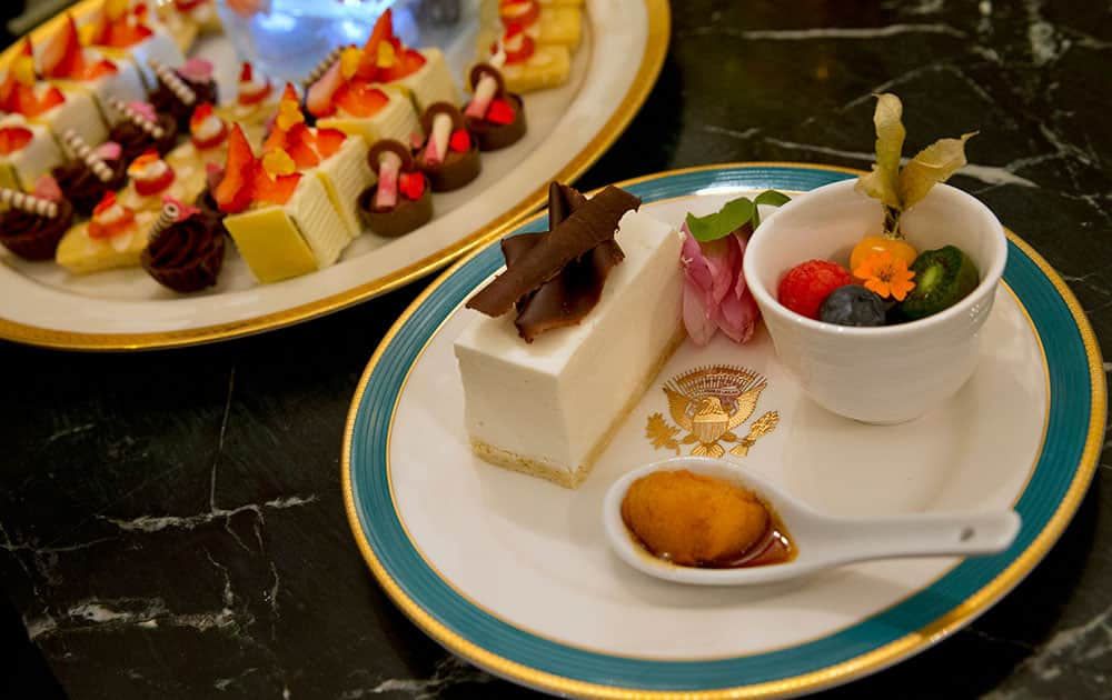 The main dessert, right, is a American style cheesecake using healthier ingredients including tofu and soy milk, accompanied but a fruit salad and petit pillow with honey from the White House South Grounds.