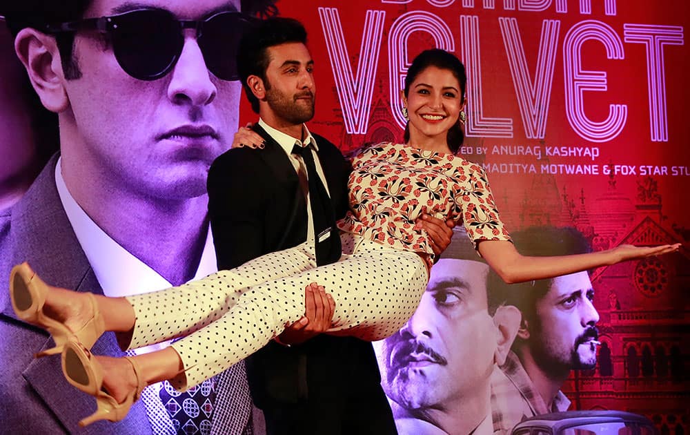 Bollywood actor Ranbir Kapoor poses for photographs with actress Anushka Sharma during a trailer launch of their film Bombay Velvet in Mumbai.