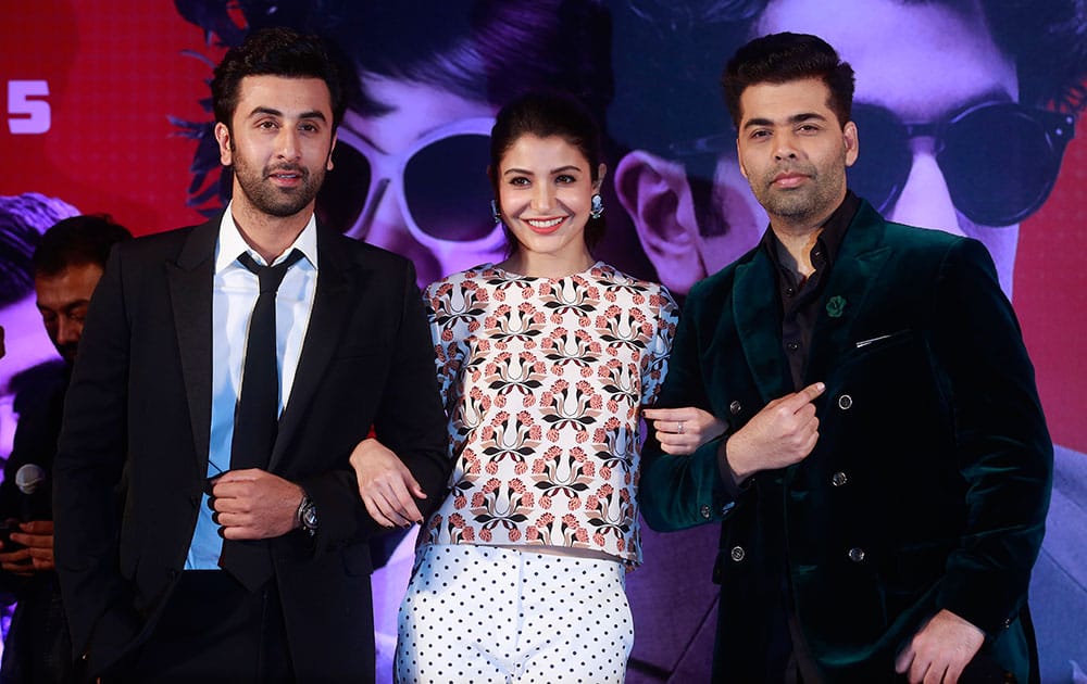 Bollywood actors Ranbir Kapoor, Anushka Sharma and Karan Johar pose during a trailer launch of their film Bombay Velvet in Mumbai.