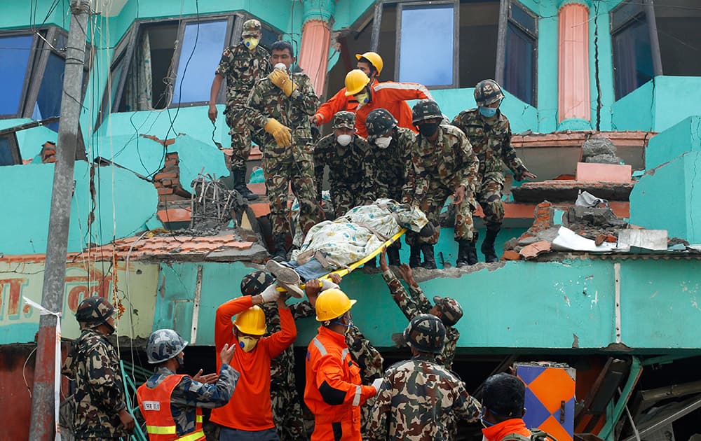  Nepalese and Indian rescue teams remove a body from the collapsed Sitapyla church in Kathmandu, Nepal.