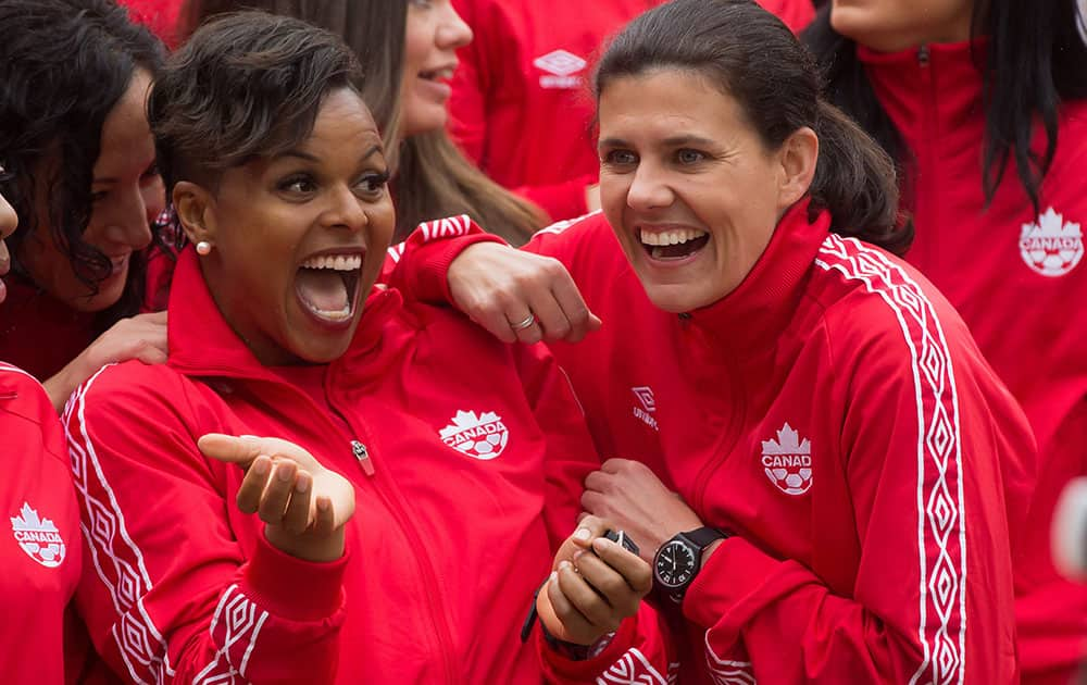 Canadian national women's soccer team goalkeeper Karina LeBlanc, left, of Maple Ridge, British Columbia., and captain Christine Sinclair, of Burnaby, British Columbia, joke around after the roster for the 2015 FIFA Women's World Cup was announced, in Vancouver, B.C.