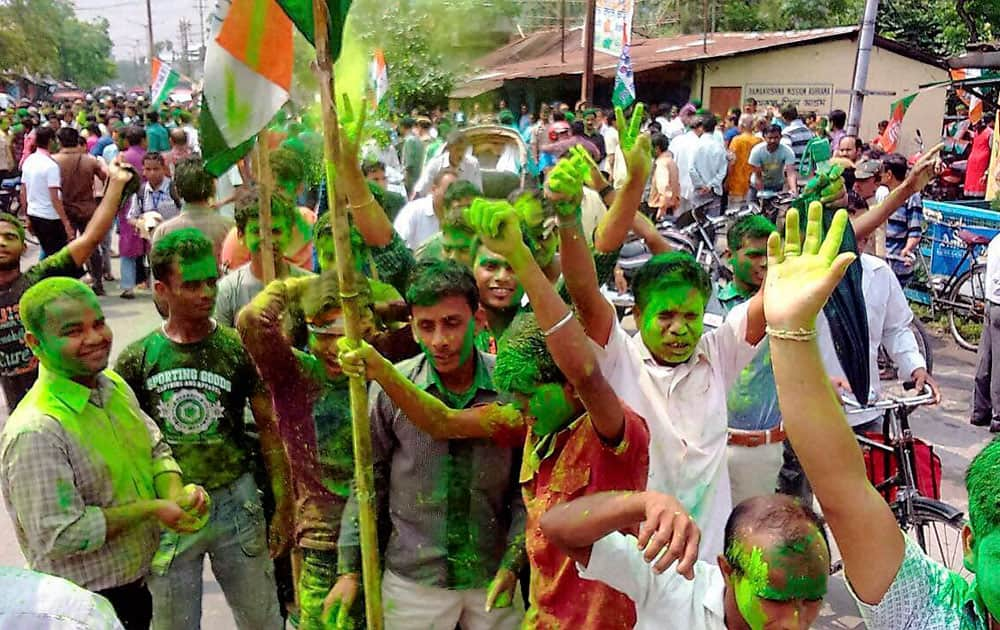 Trinamool Congress supporters celebrate after winning in the Municipal Election.