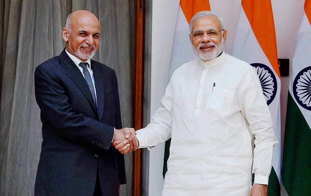 PM Narendra Modi shakes hands with Afghan President Mohammad Ashraf Ghani during a meeting at Hyderabad House in New Delhi.