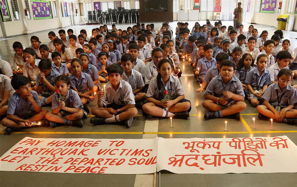 Students at a school pay tribute to earthquake victims in Gurgaon.