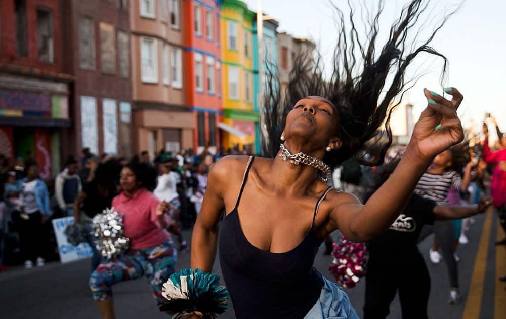 People dance in Baltimore. Maryland's governor vowed there would be no repeat of the looting, arson and vandalism that erupted Monday in some of the city's poorest neighborhoods.