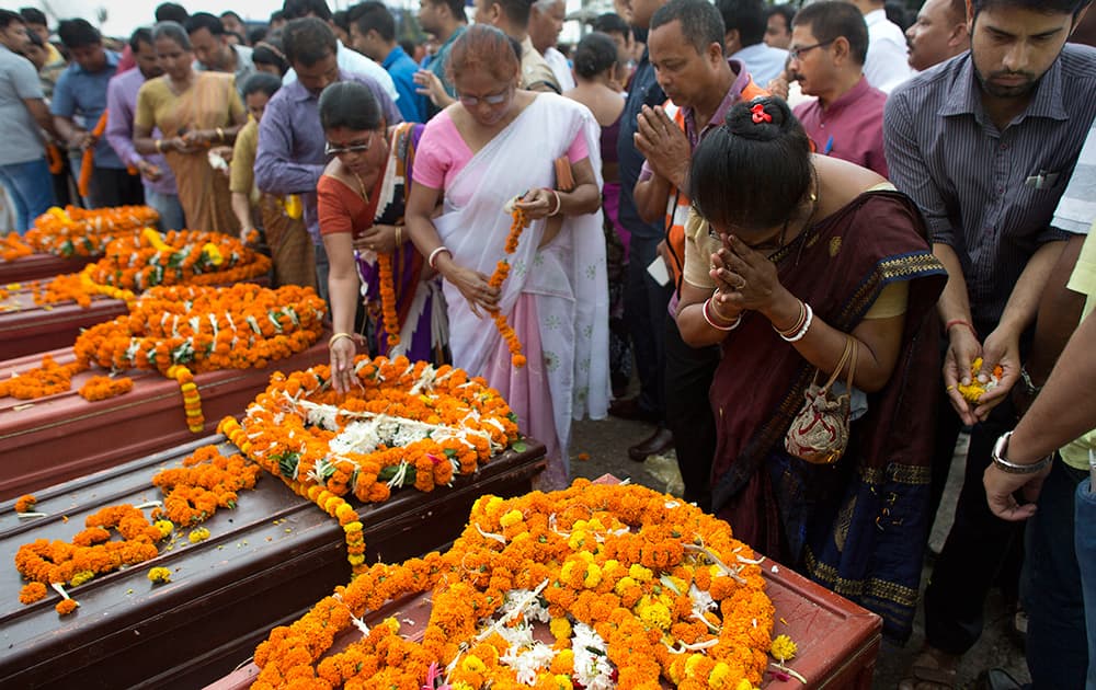 People pay their last tributes to victims of Saturday’s earthquake in Nepal, after their bodies arrived in Guwahati.