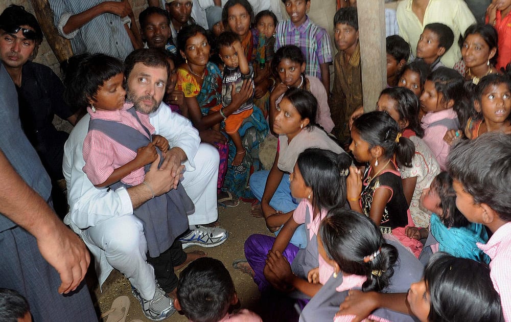 Congress Vice President Rahul Gandhi meeting with children during his ‘Padyatra’ in Tonglabad village in Amravati district of Maharashtra.