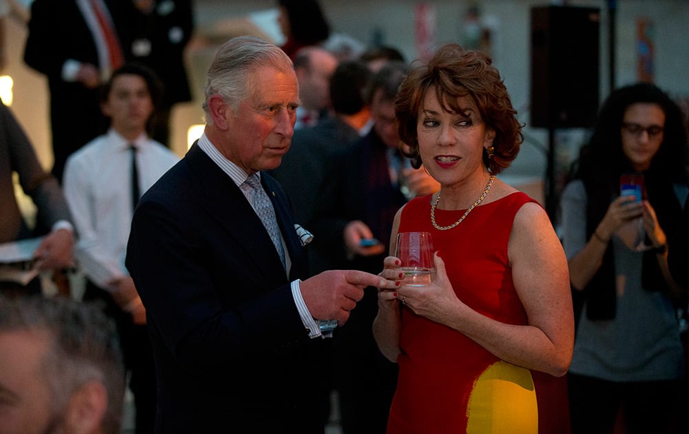 Britain's Prince Charles chats with Australian-British author Kathy Lette as he visits the 'Indigenous Australia: Enduring Civilisation' exhibition at the British Museum in London.