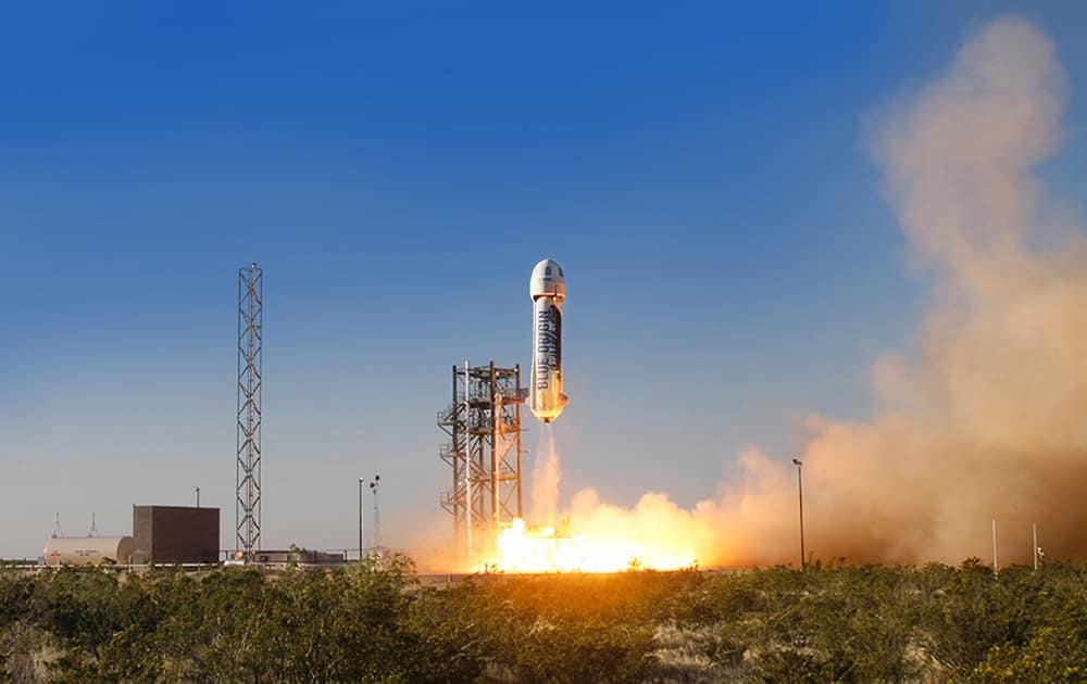 This photo provided by Blue Origin, the New Shepard space vehicle blasts off on its first developmental test flight over Blue Origin's west Texas Launch Site.