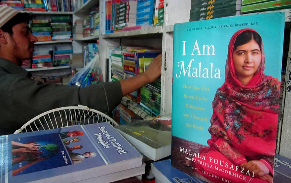 A book about Pakistan's Nobel Prize winner Malala Yousafzai, who survived the Taliban's attack, is on display at a bookstore in Malala's home town of Mingora, Pakistan.