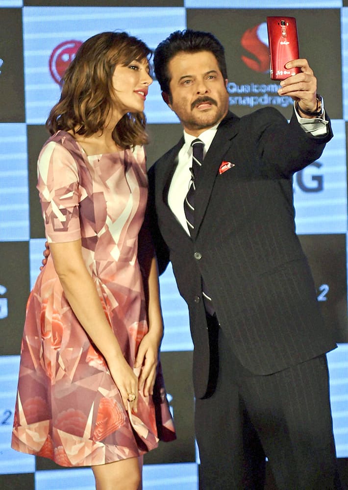 Bollywood actor Anil Kapoor and actress Nargis Fakri during the launch of LG G Flex2 in Mumbai.