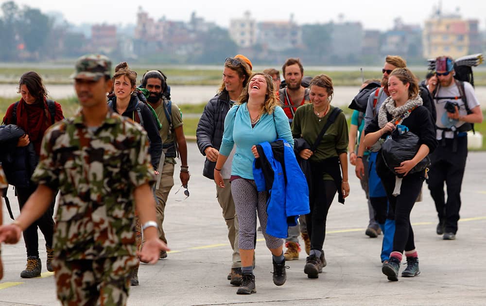 Trekkers arrive at the Tribhuvan International Airport after being evacuated from Langtang trekking route by the Indian air force, in Kathmandu, Nepal.