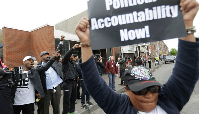 Baltimore crowds celebrate tough charges against police