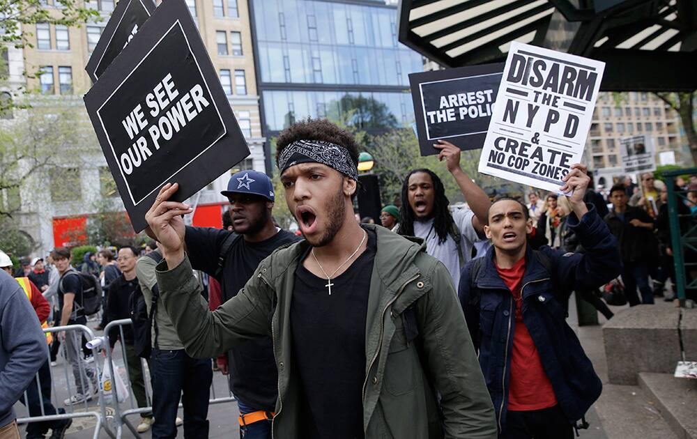 Demonstrators march in Union Square in New York. About 1,000 protesters decrying police brutality marched in Manhattan at a May Day rally that took on a new message amid national outrage over a Baltimore man's death in police custody.