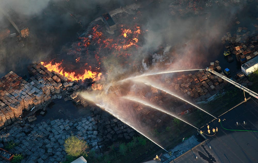 Firefighters spray water on a fire at a warehouse in south Columbus, Ohio.
