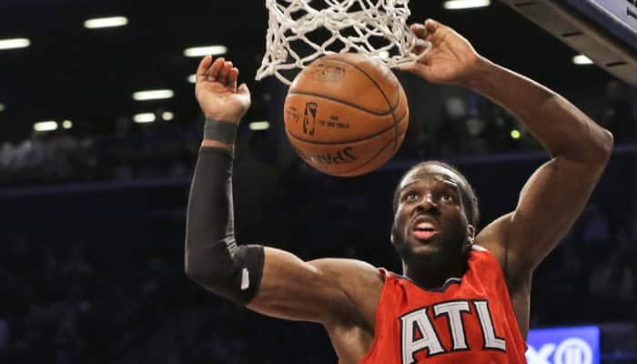 Hawks crush Nets to advance in playoffs