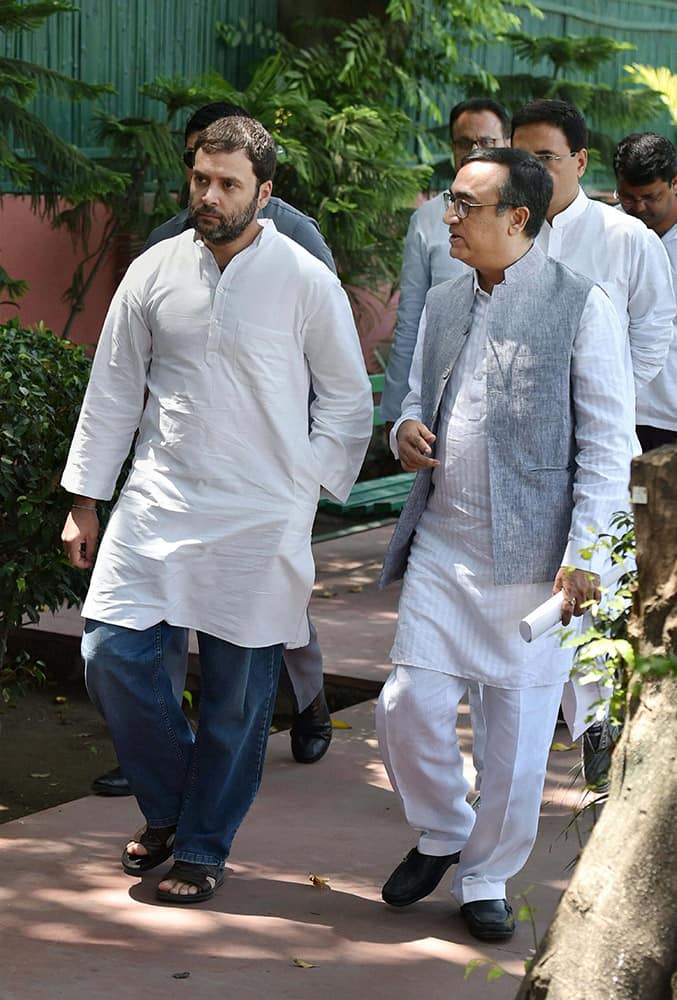 AICC Vice President Rahul Gandhi with Delhi Congress chief Ajay Maken arrives to meet representatives of organizations of home/flat buyers in Delhi-NCR region, at AICC office in New Delhi.