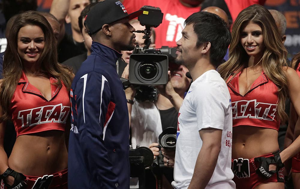 Floyd Mayweather Jr. and Manny Pacquiao pose during their weigh-in. The world weltherweight title fight between Mayweather Jr. and Pacquiao is scheduled for May 2.