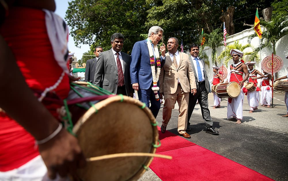 US Secretary of State John Kerry accompanied by Sri Lankan Deputy Foreign Affairs Minister Ajith Perera and Sri Lankan Minister of Justice Wijeyadasa Rajapakshe, arrives for a meeting with Sri Lankan Foreign Minister Mangala Samaraweera at the Ministry of Foreign Affairs in Colombo, Sri Lanka..