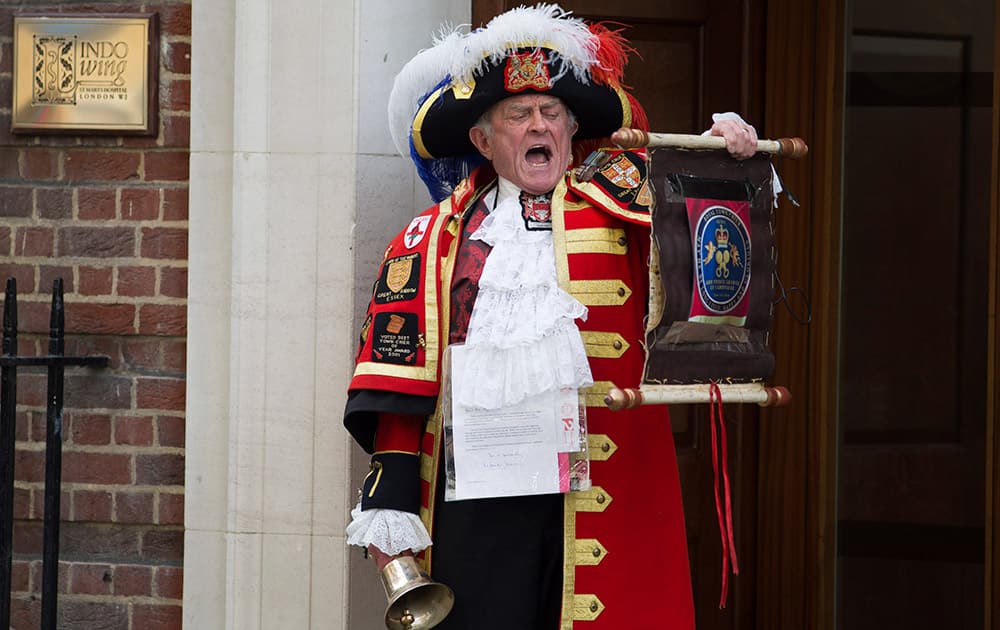 Tony Appleton, a town crier, announces the birth of the royal baby outside the Lindo Wing, St. Mary's Hospital, London. Kate, the Duchess of Cambridge, has given birth to a baby girl, royal officials said Saturday.