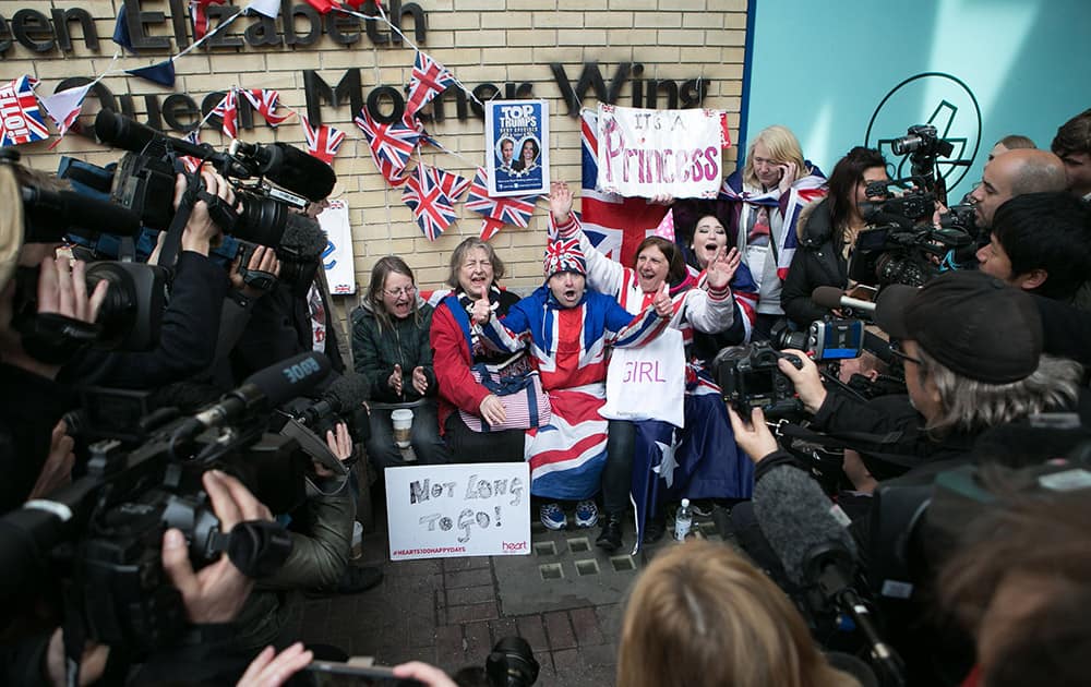 Members of the media surround royal fans and well wishers after Kensington Palace announced that Kate, the Duchess of Cambridge, had given birth to a girl, outside the Lindo Wing of St. Mary's Hospital, London.