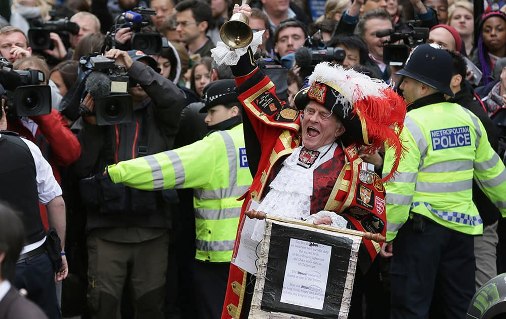 Tony Appleton, a town crier, announces to the assembled media the birth of the royal baby, outside the Lindo Wing, St. Mary's Hospital, London. Kate, the Duchess of Cambridge, has given birth to a baby girl, royal officials said Saturday.