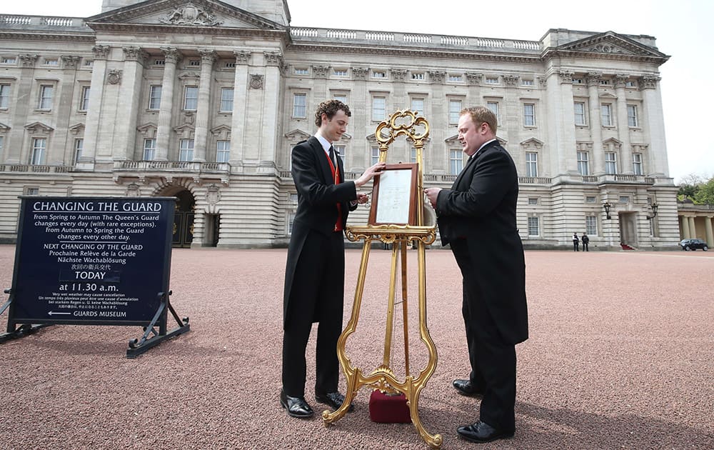 An easel is placed in the forecourt of Buckingham Palace in London to announce the birth of the royal baby. Kate, the Duchess of Cambridge, has given birth to a baby girl, royal officials said Saturday.