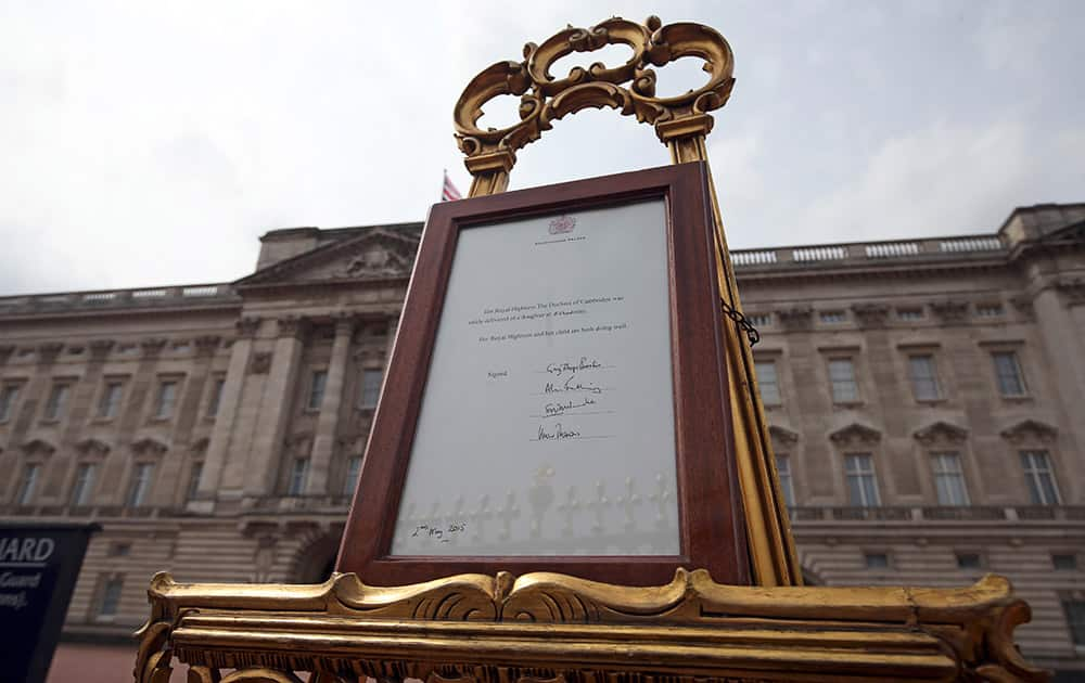 An easel is placed in the forecourt of Buckingham Palace in London to announce the birth of the royal baby. Kate, the Duchess of Cambridge, has given birth to a baby girl, royal officials said Saturday.