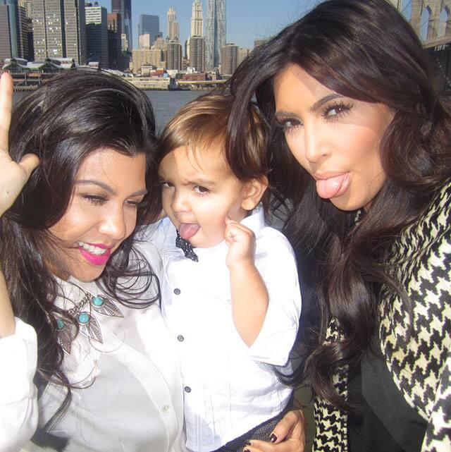 Kim Kardashian West :- Luv being in NYC! Looking thru my book Selfish & loving this pic of @kourtneykardash, Mason &I back in 2010 #SELFISH -twitter