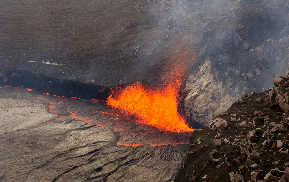 this  photo provided by US Geological Survey Hawaiian Volcano Observatory, sparks rise from Kilauea volcano on Hawaii’s Big Island. 