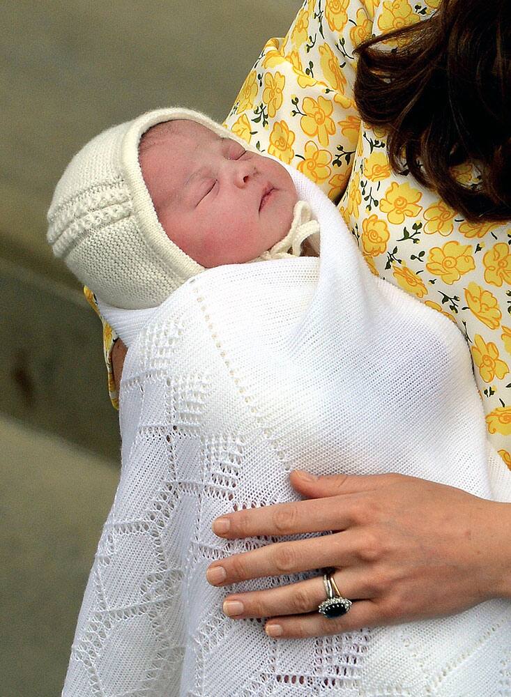 Kate, Duchess of Cambridge holds her newborn baby princess, as she poses for the media on the steps of The Lindo Wing of St. Mary's Hospital, London.