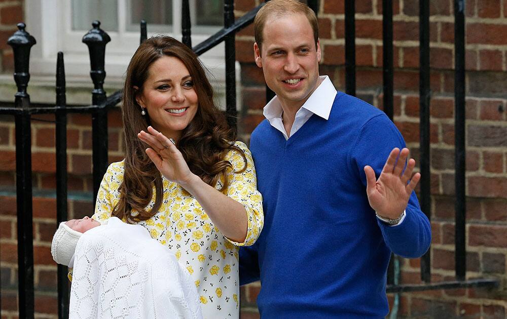 Britains Prince William and Kate, Duchess of Cambridge and their newborn baby princess, pose for the media as they leave St. Marys Hospitals exclusive Lindo Wing, London.