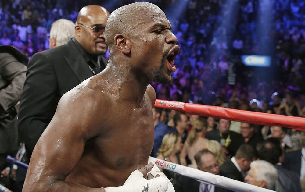 Floyd Mayweather Jr., celebrates his unanimous decision victory over Manny Pacquiao, from the Philippines, at the finish of their welterweight title fight in Las Vegas.