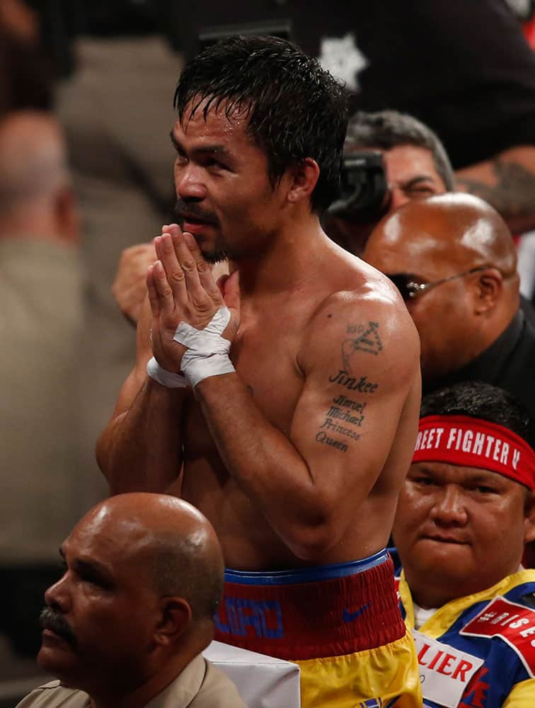 Manny Pacquiao, from the Philippines, greets fans after his welterweight title against Floyd Mayweather Jr., in Las Vegas.