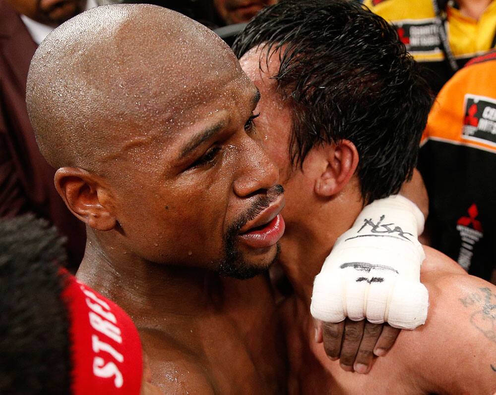 Floyd Mayweather Jr., left, and Manny Pacquiao, from the Philippines, embrace in the ring at the finish of their welterweight title fight in Las Vegas. 