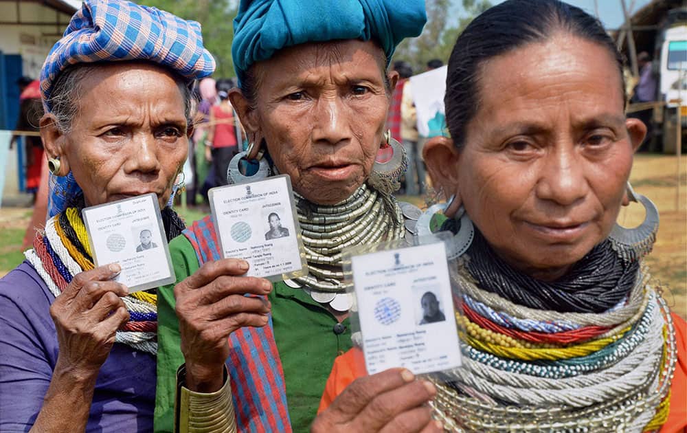Reang tribal women walk out of a polling booth after casting their vote for Tripura Tribal Areas Autonomous District Council (TTAADC) at Ambasha District, in Agartala.