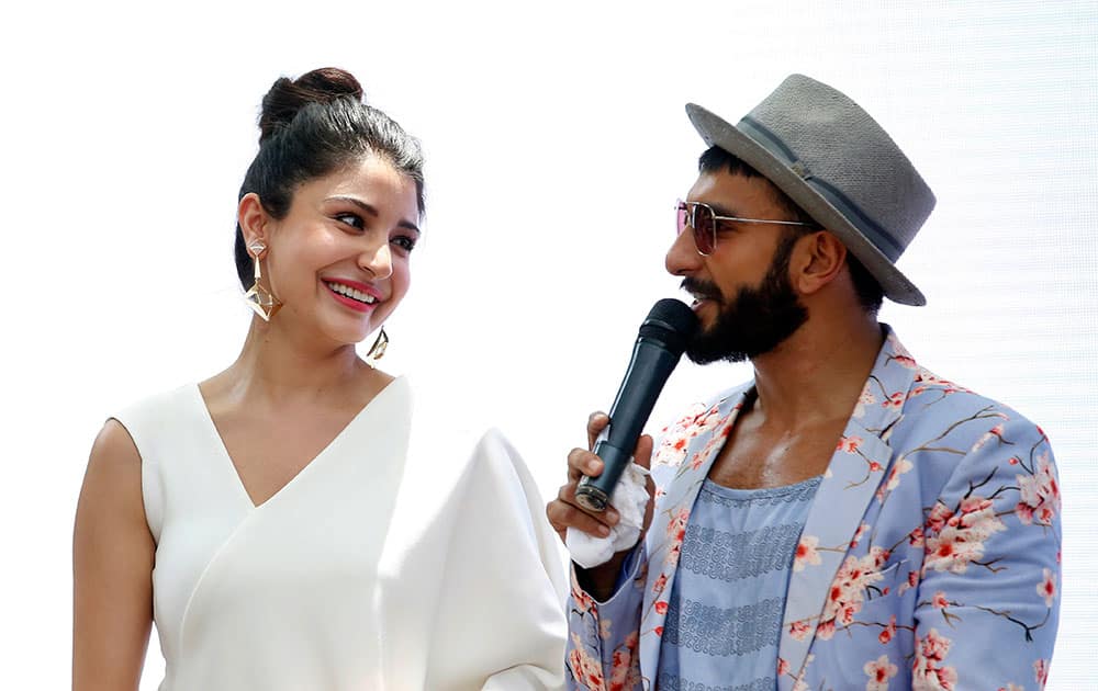 Bollywood actress Anushka Sharma, left, listens to co star Ranveer Singh, during the song launch of the upcoming movie ‘Dil Dhadakne Do’ in Mumbai.